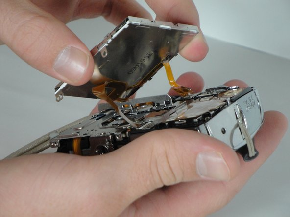 Disassembling Canon PowerShot SD800 IS Lens Assembly: step 10, image 1 of 1