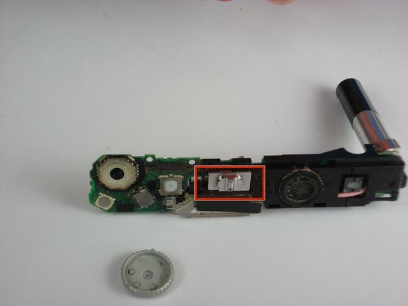 Panasonic Lumix DMC-FX01 On/ Off and Settings Button cover replacement: step 17, image 1 of 1