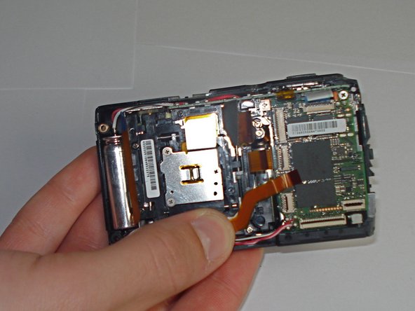 Disassembling Olympus Stylus 1010 Logic Board: step 8, image 2 of 2