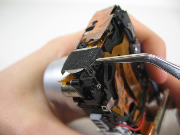 Disassembling Pentax Optio S4i Lens Assembly: step 18, image 1 of 3