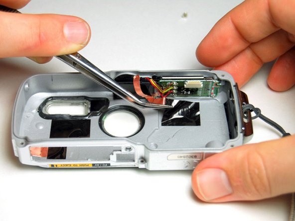 Pentax Optio WP Shutter and Power Buttons Replacement: step 9, image 1 of 3