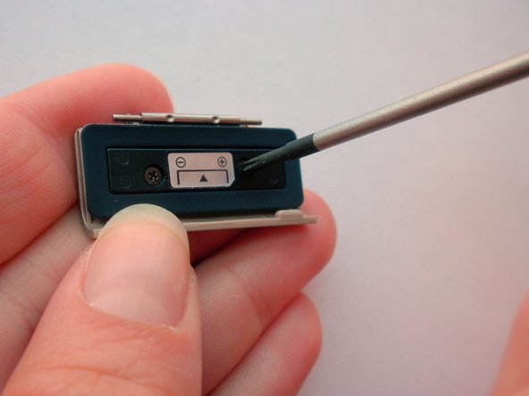 Olympus Stylus 410 Battery Cover Replacement: step 13, image 2 of 3