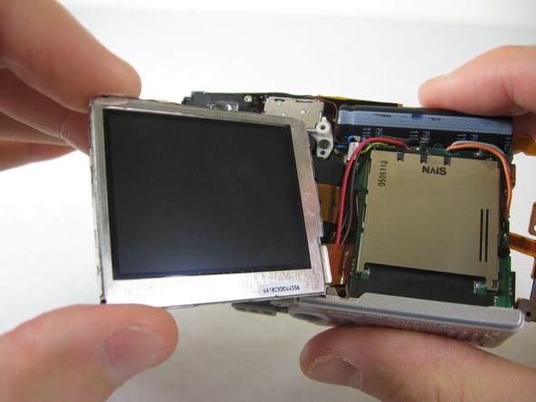 Disassembling Pentax Optio S4i Lens Assembly: step 17, image 1 of 3