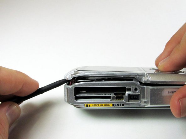 Pentax Optio WP Shutter and Power Buttons Replacement: step 6, image 1 of 3