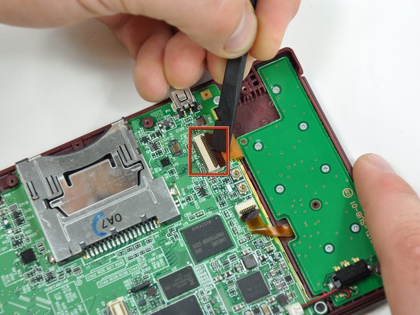 Nintendo DSi XL Camera Ribbon Replacement: step 14, image 1 of 2