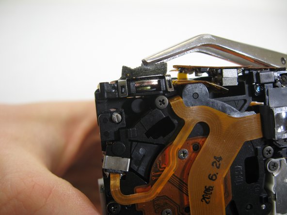 Disassembling Pentax Optio S4i Lens Assembly: step 18, image 3 of 3