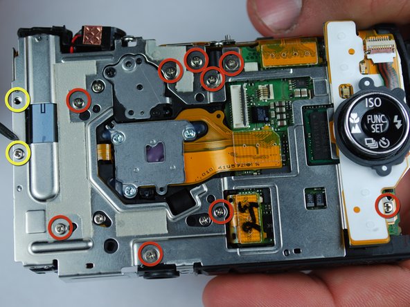 Canon PowerShot SD870 IS Card and Battery Slot Replacement: step 16, image 1 of 2