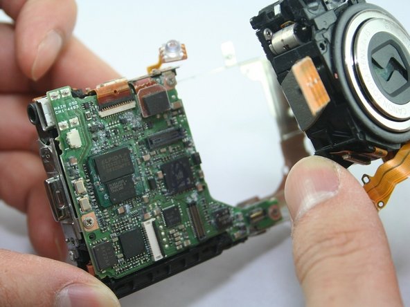 Disassembling Canon PowerShot SD1100 IS AV port and Logic board: step 19, image 2 of 2