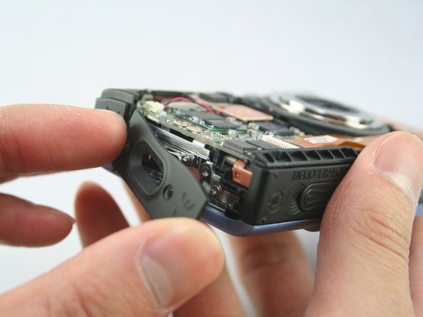 Disassembling Canon PowerShot SD1100 IS Front and Rear Cover: step 3, image 2 of 3