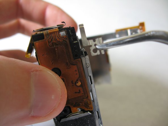 Disassembling Pentax Optio S4i Lens Assembly: step 14, image 1 of 1