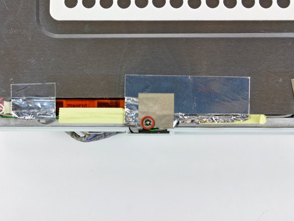 iBook G4 14" 933 MHz-1.33 GHz Front Display Bezel Replacement: step 50, image 1 of 2