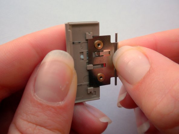 Olympus Stylus 410 Battery Cover Replacement: step 14, image 1 of 2