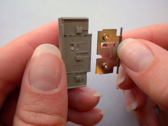 Olympus Stylus 410 Battery Cover Replacement: step 14, image 2 of 2