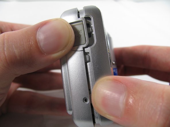 Removing Olympus FE-210 Flash Assembly: step 4, image 1 of 3