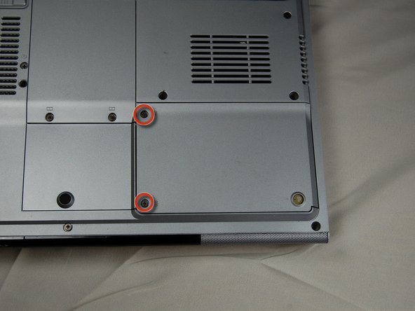 HP Pavilion dv1000 Back Cover Replacement: step 6, image 1 of 3