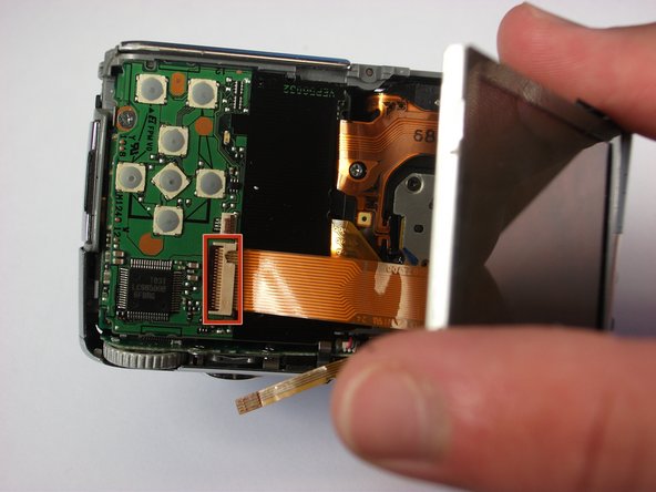 Panasonic Lumix DMC-FX01 On/ Off and Settings Button cover replacement: step 11, image 1 of 1