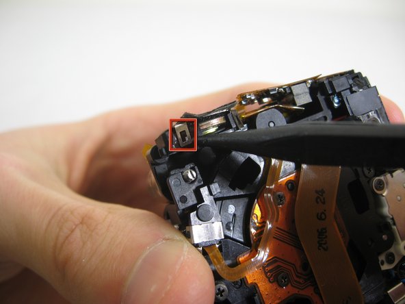 Disassembling Pentax Optio S4i Lens Assembly: step 19, image 1 of 3