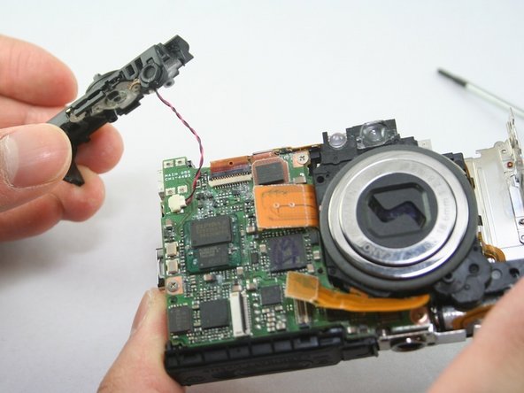 Canon PowerShot SD1100 IS Top Button Assembly Replacement: step 6, image 1 of 1