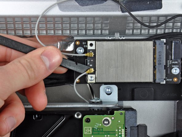 iMac Intel 27" EMC 2309 and 2374 AirPort Card Replacement: step 10, image 1 of 2