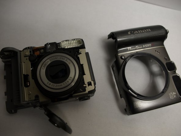 Disassembling Canon PowerShot A590 IS Front Cover, Remove Front Cover: step 9, image 2 of 2