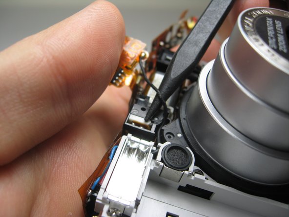 Disassembling Pentax Optio S4i Lens Assembly: step 24, image 1 of 2