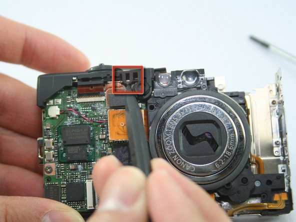 Canon PowerShot SD1100 IS Top Button Assembly Replacement: step 5, image 1 of 1