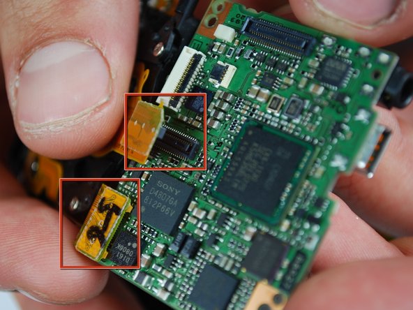 Canon PowerShot SD870 IS Card and Battery Slot Replacement: step 18, image 1 of 2