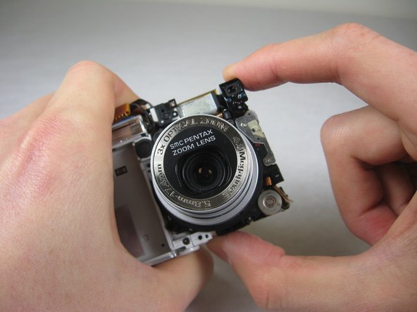 Disassembling Pentax Optio S4i Lens Assembly: step 30, image 1 of 3