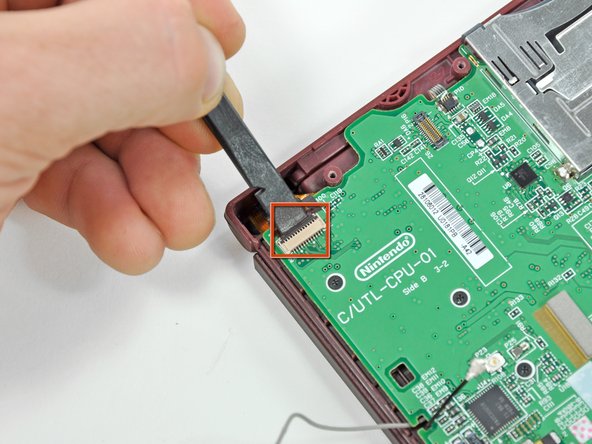 Nintendo DSi XL Camera Ribbon Replacement: step 11, image 1 of 2