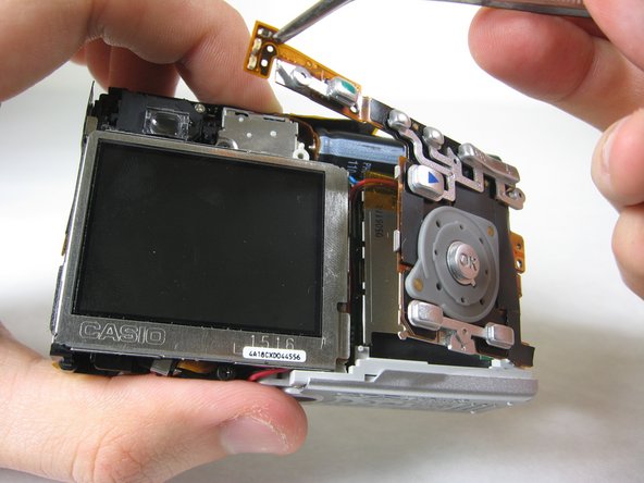 Disassembling Pentax Optio S4i Lens Assembly: step 9, image 2 of 3