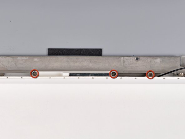 MacBook Unibody Model A1342 Rear Display Bezel Replacement: step 35, image 1 of 1