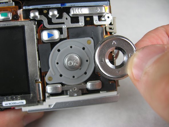 Disassembling Pentax Optio S4i Lens Assembly: step 4, image 1 of 3