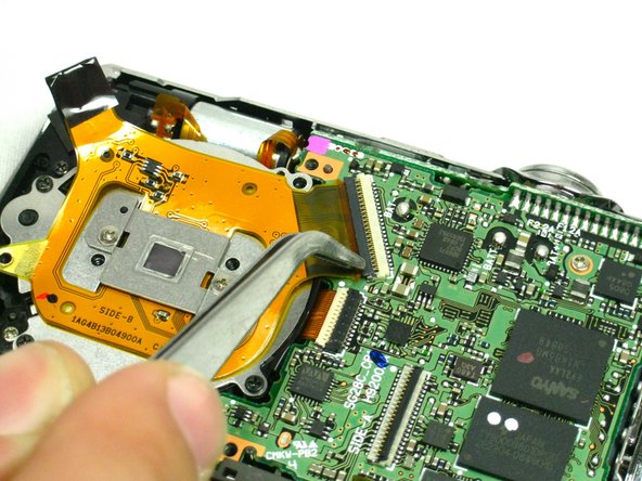 Nikon Coolpix S220 Lens Replacement: step 13, image 1 of 2