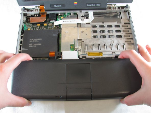 PowerBook 3400 M3553 Track Pad Panel Replacement: step 9, image 1 of 3
