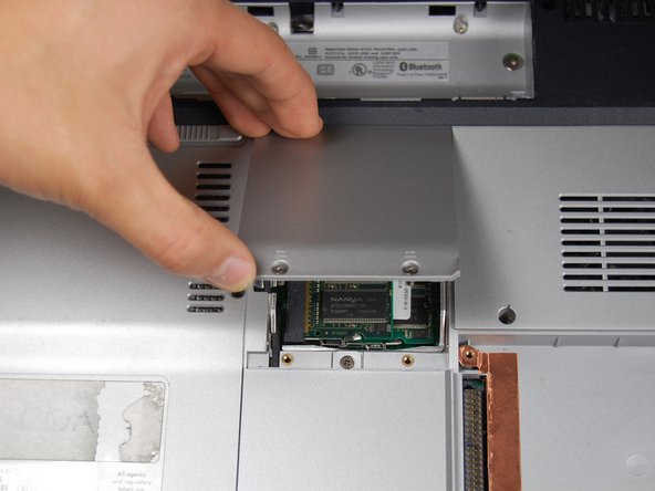 HP Pavilion dv1000 Back Cover Replacement: step 10, image 1 of 2
