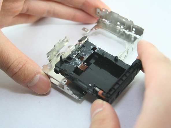 Disassembling Canon PowerShot SD1100 IS AV port and Logic board: step 26, image 3 of 3