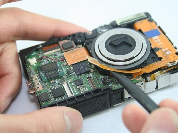 Disassembling Canon PowerShot SD1100 IS AV port and Logic board: step 12, image 2 of 2