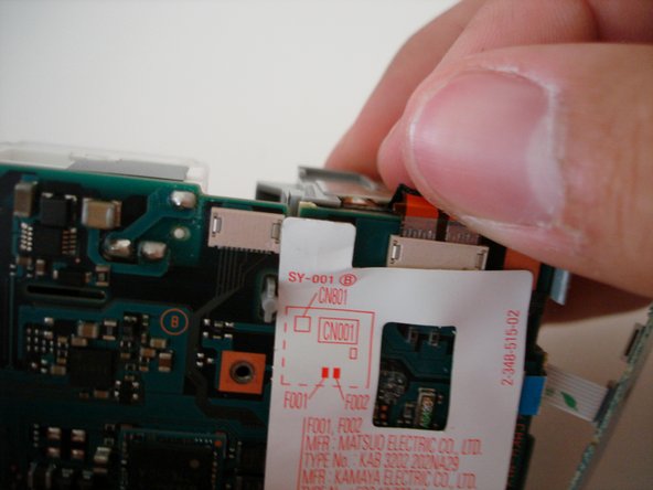 Sony Cyber-shot DSC-W5 battery compartment replacement: step 13, image 2 of 2