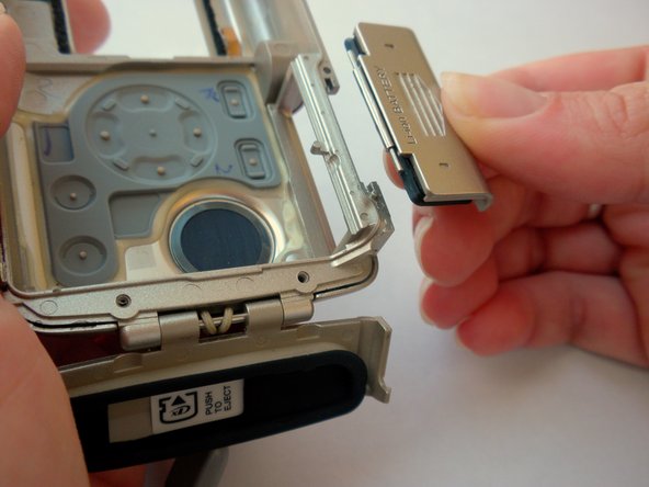 Olympus Stylus 410 Battery Cover Replacement: step 12, image 2 of 2