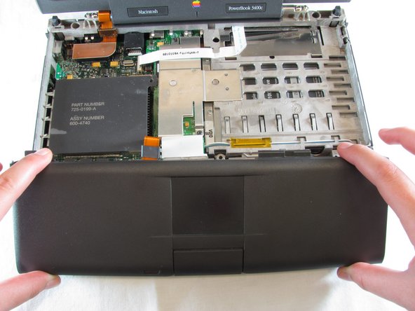 PowerBook 3400 M3553 Track Pad Panel Replacement: step 9, image 2 of 3