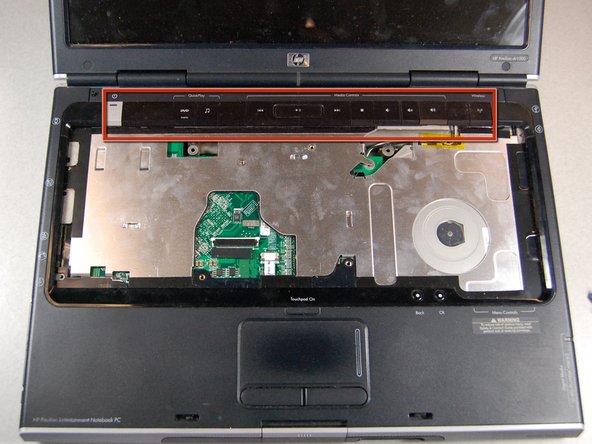 HP Pavilion dv1000 Back Cover Replacement: step 19, image 1 of 2