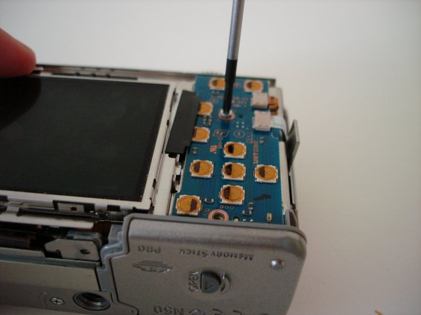 Sony Cyber-shot DSC-W5 battery compartment replacement: step 4, image 2 of 2