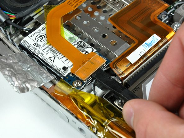 PowerBook G4 Aluminum 17" 1.67 GHz (High-Res) PC Card Cage Replacement: step 12, image 1 of 1