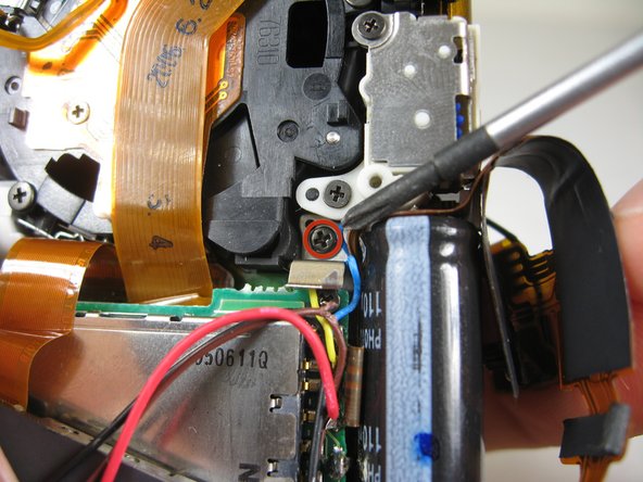 Disassembling Pentax Optio S4i Lens Assembly: step 28, image 1 of 3