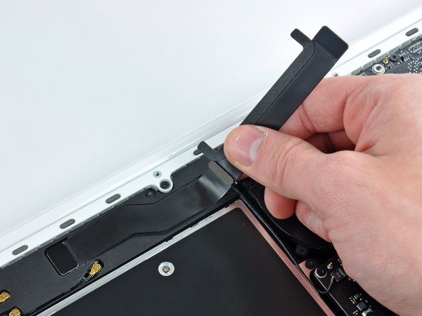 MacBook Unibody Model A1342 AirPort/Bluetooth Cable Replacement: step 4, image 2 of 2