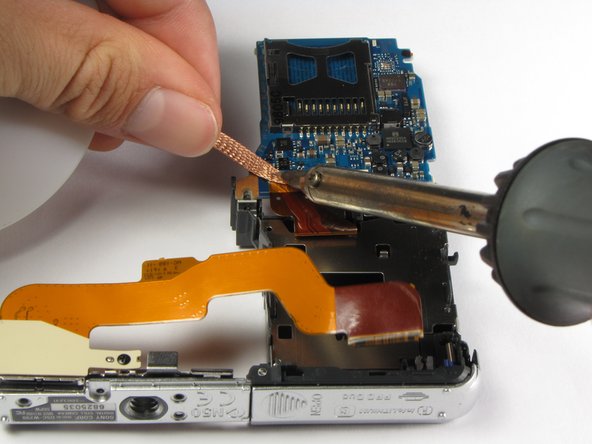 Repairing Sony Cyber-shot DSC-W290 Motherboard: step 24, image 2 of 3