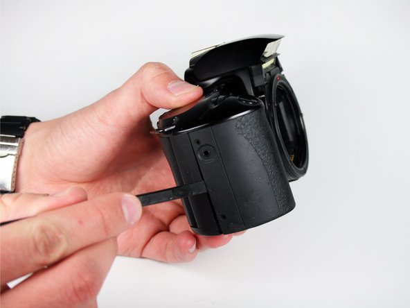 Disassembling Canon EOS Rebel XS Battery Door: step 8, image 1 of 3