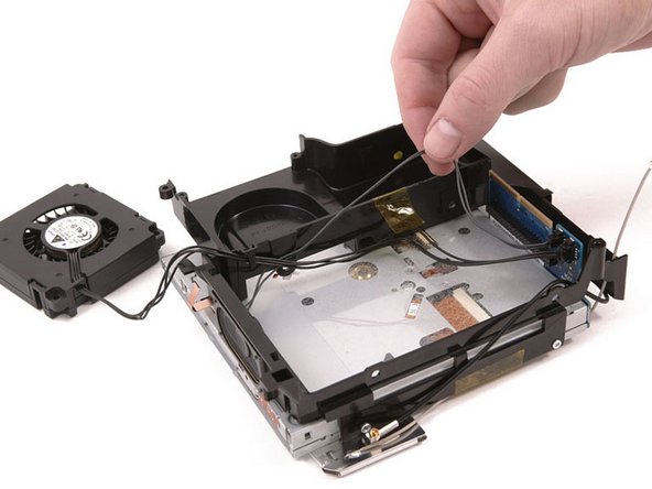 Mac mini (PowerPC) Speaker Replacement: step 18, image 1 of 1