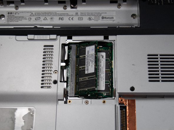 HP Pavilion dv1000 Back Cover Replacement: step 11, image 2 of 2