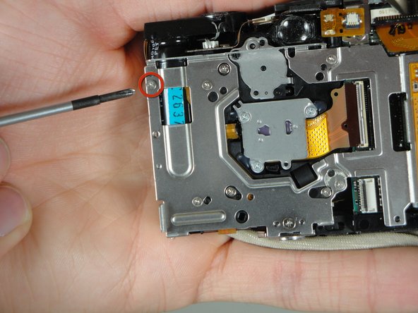 Disassembling Canon PowerShot SD800 IS Lens Assembly: step 12, image 1 of 1